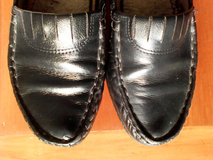 pair of shoes, one polished and one unpolished