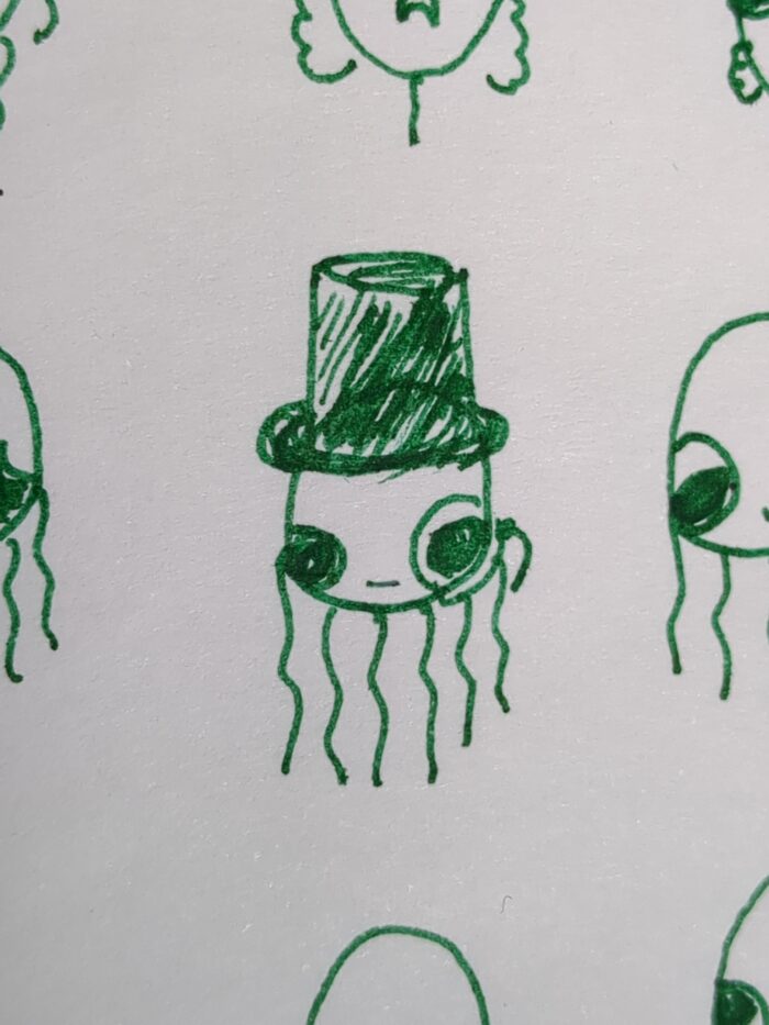 A green ink drawing of a jellyfish with top hat and monocle.